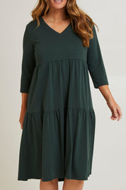 Model Laura wearing size 14 of The 3/4 Sleeve Tiered Jersey Dress in colour Thymegreen (Green), from the front, cropped image