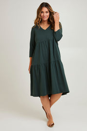 Model Laura wearing size 14 of The 3/4 Sleeve Tiered Jersey Dress in colour Thymegreen (Green), from the front, showing the whole outfit