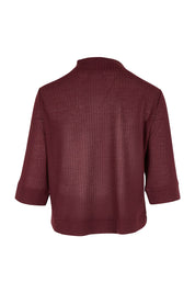 Product shot of The Textured Shrug in colour Mulberry (Purple), from the back