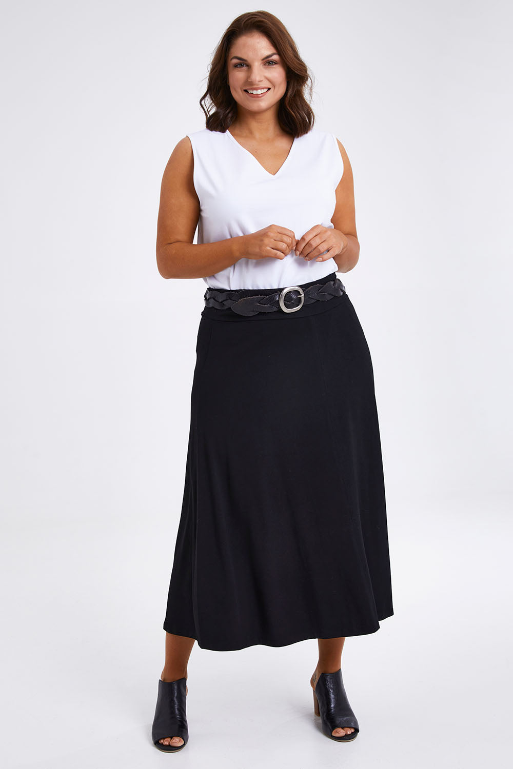 Model Monique wearing size 14 of The Fit & Flare Summer Skirt in colour Black (Black), from the front, showing the whole outfit