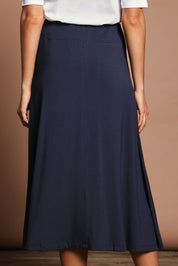 Model Madeline wearing size 10 of The Fit & Flare Summer Skirt in colour Navy (Blue), from the back