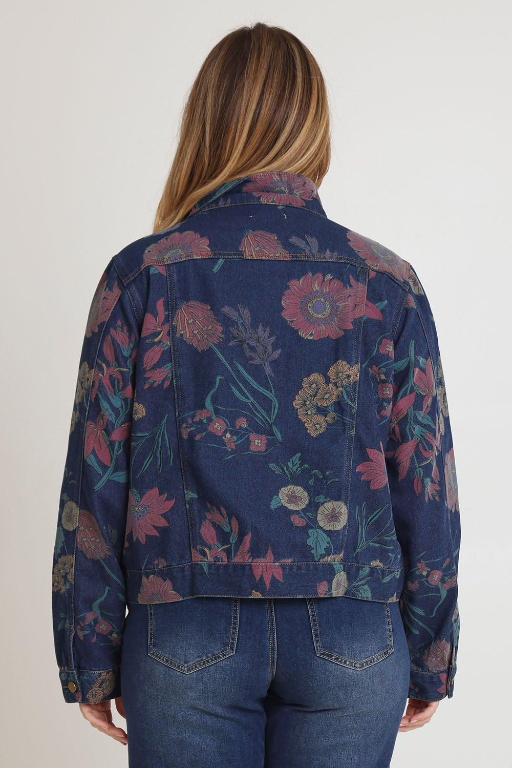 Model Chanel wearing size 16 of The Keepers Printed Denim Jacket in colour Redfloral (Blue), from the back