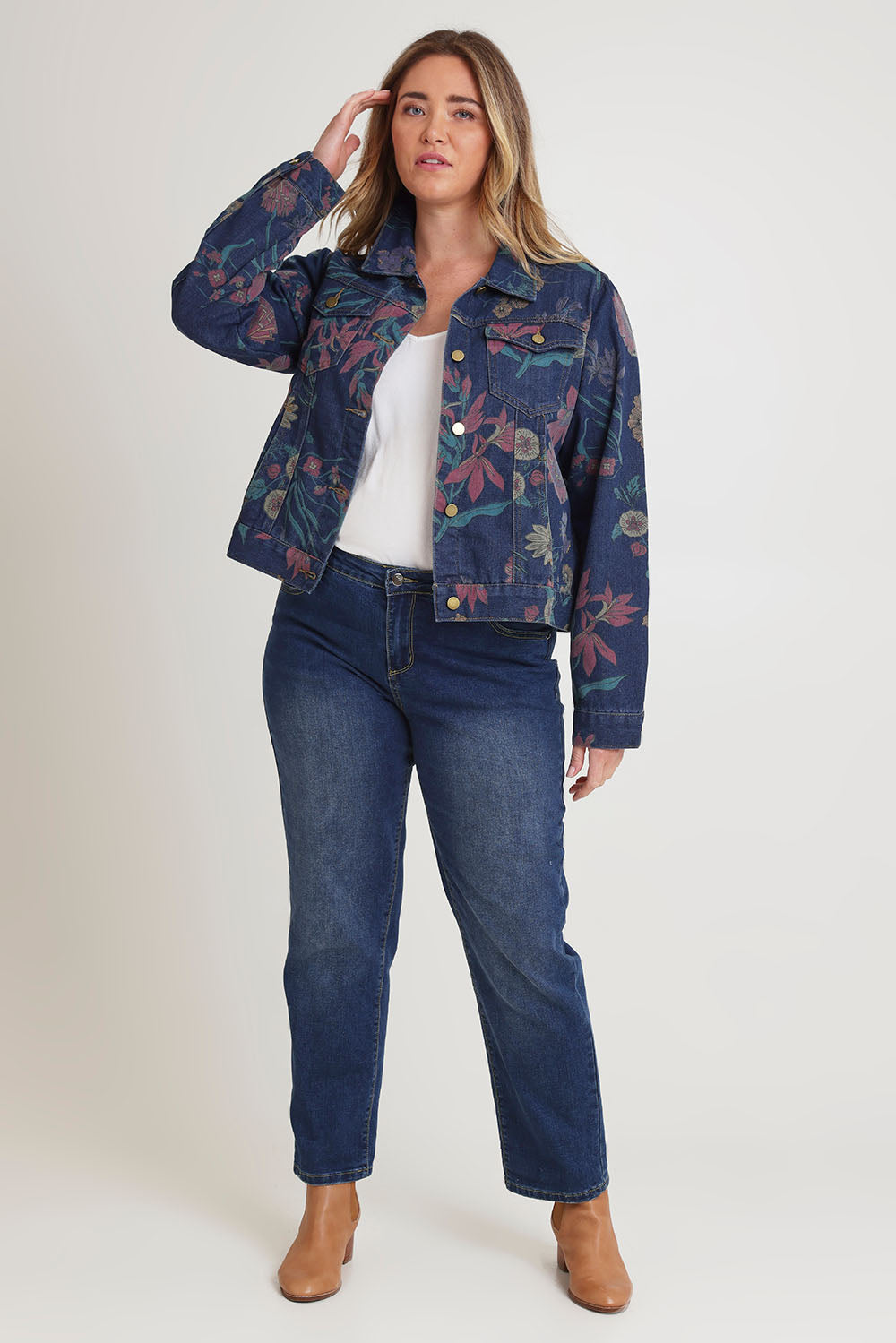 Model Chanel wearing size 16 of The Keepers Printed Denim Jacket in colour Redfloral (Blue), from the front, showing the whole outfit
