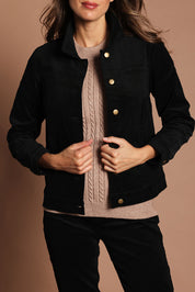 Model Madeline wearing size 10 of The Keepers Cord Jacket in colour Black (Black), from the front, cropped image