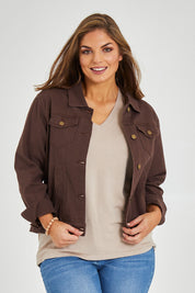 Model Monique wearing size 14 of The Slim Fit Denim Jacket in colour Chocolate, from the front, cropped image
