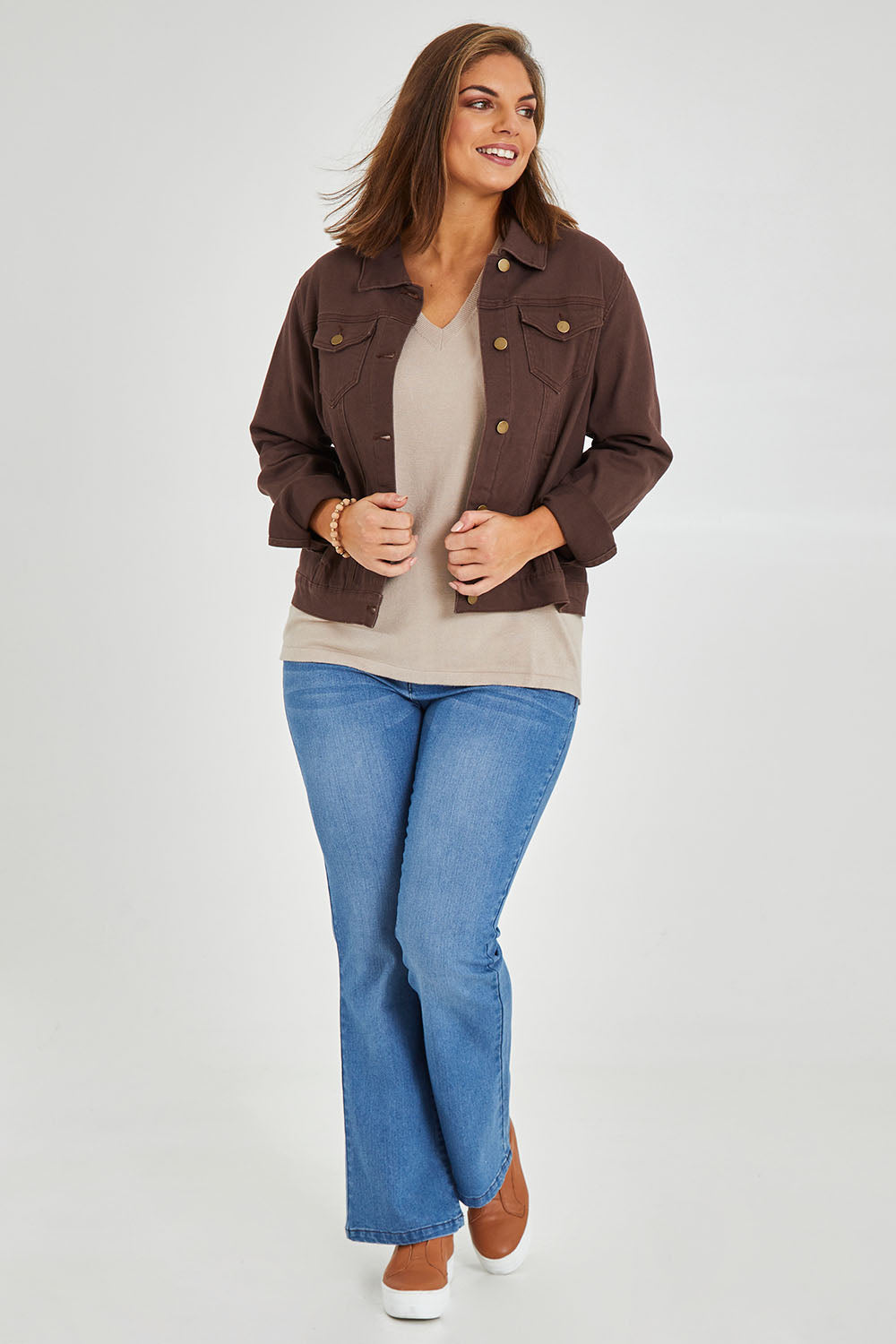 Model Monique wearing size 14 of The Slim Fit Denim Jacket in colour Chocolate, from the front, showing the whole outfit