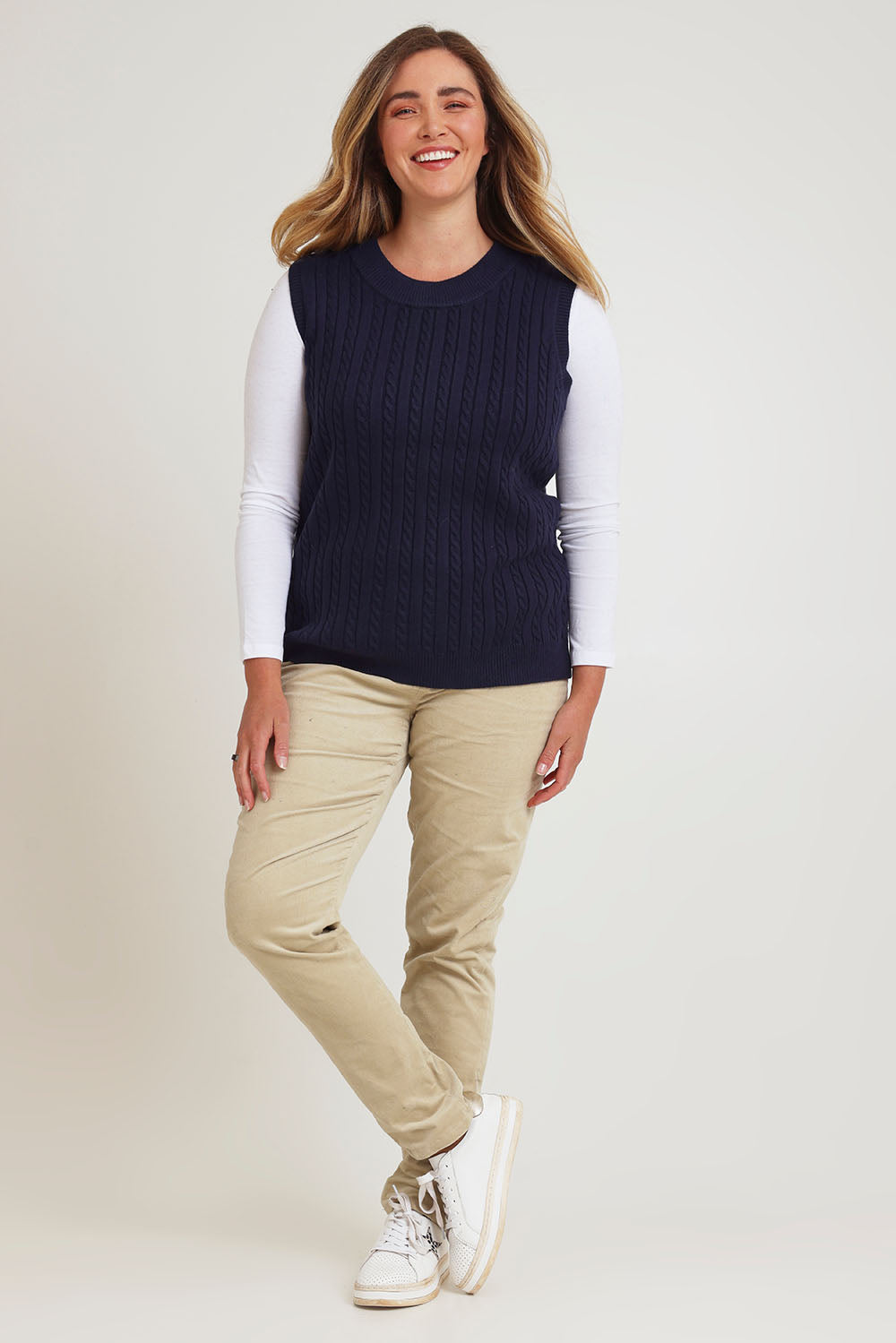 Model Chanel wearing size XL of The Soft Sleeveless Cable Knit Jumper in colour Richnavy (Blue), from the front, showing the whole outfit