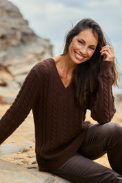 Model Amanda wearing size S of The V Neck Cable Knit Jumper in colour Coffeebean, from the front, showing the whole outfit