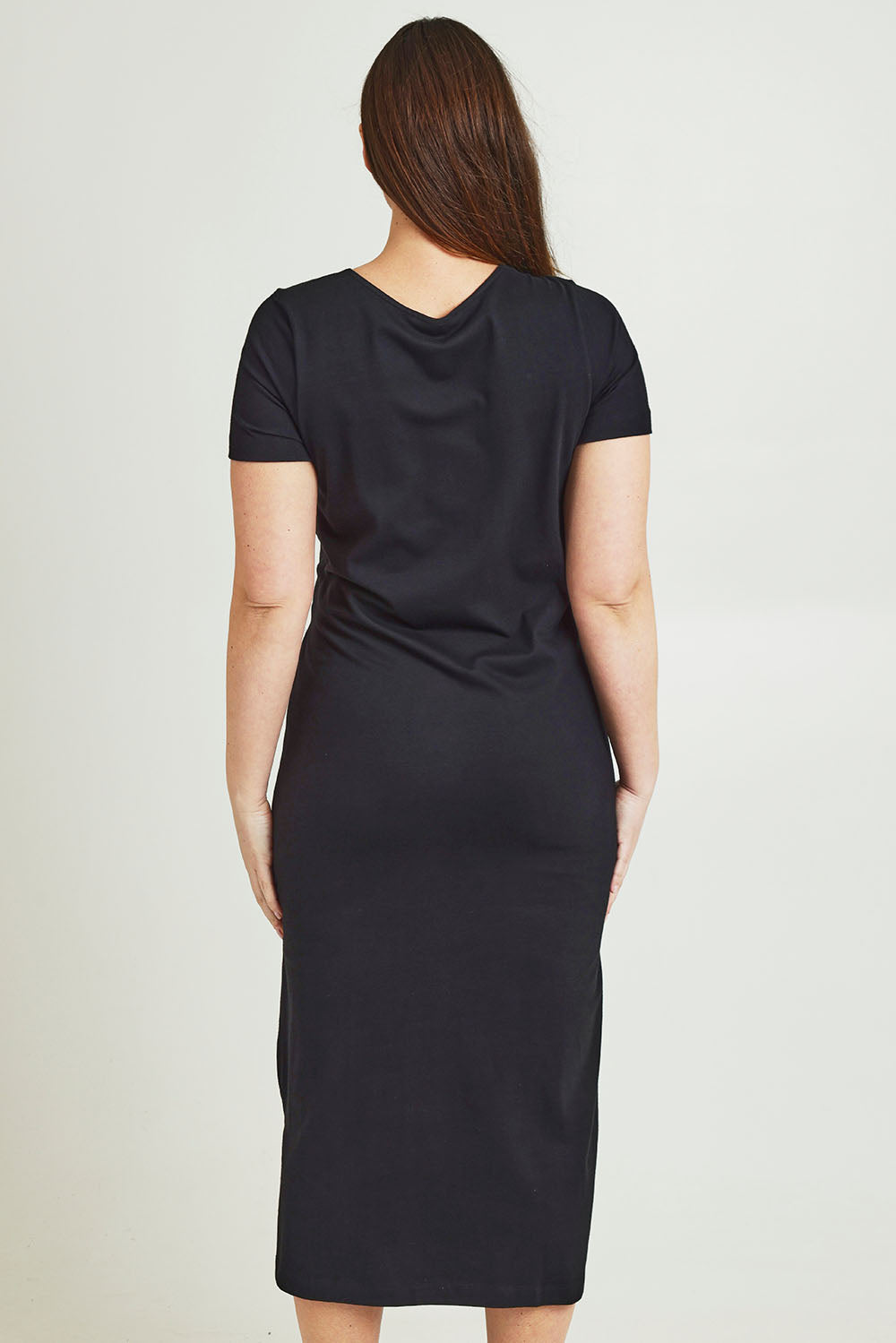 Model Jane wearing size 14 of The Short Sleeve Side Tie Tee Dress in colour Black (Black), from the back