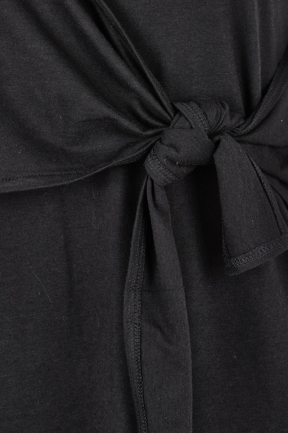Product shot of The Short Sleeve Side Tie Tee Dress in colour Black (Black), detail