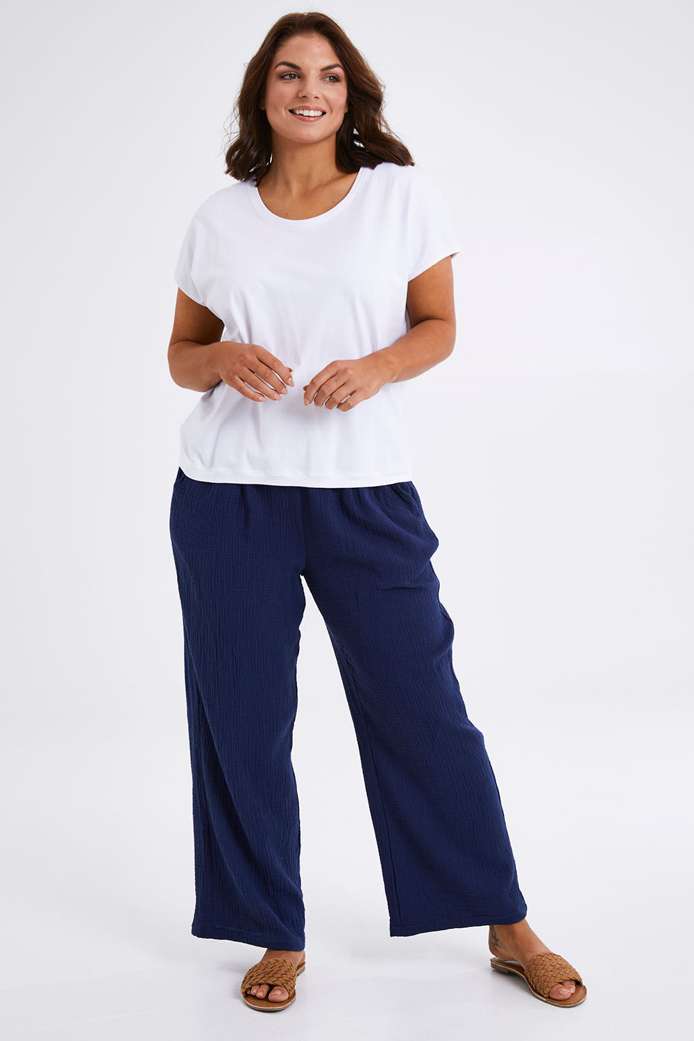 Model Monique wearing size 14 of The Double Cotton Pull On Pant in colour Navy (Blue), from the front, showing the whole outfit