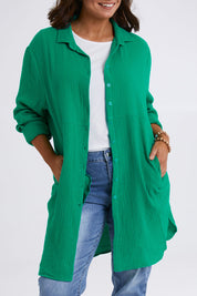 Model Monique wearing size 14 of The Double Cotton Long Overshirt in colour Emerald (Green), from the front, cropped image