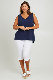 Model Monique wearing size 14 of The Double Cotton V Tank in colour Navy (Blue), from the front, showing the whole outfit