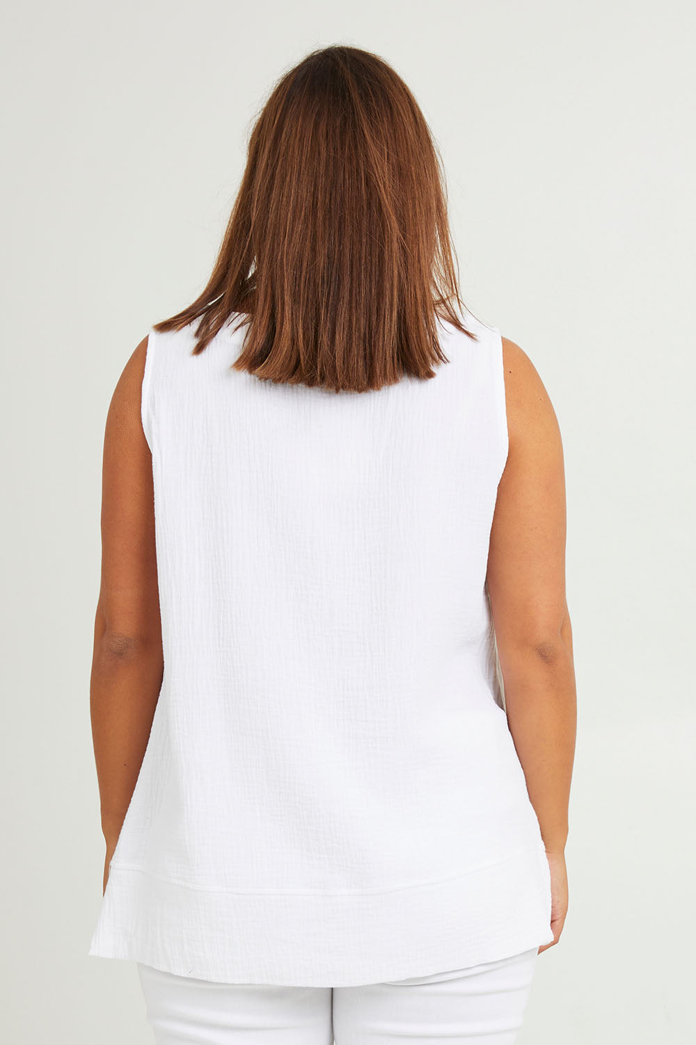 Model Monique wearing size 14 of The Double Cotton V Tank in colour White (White), from the back