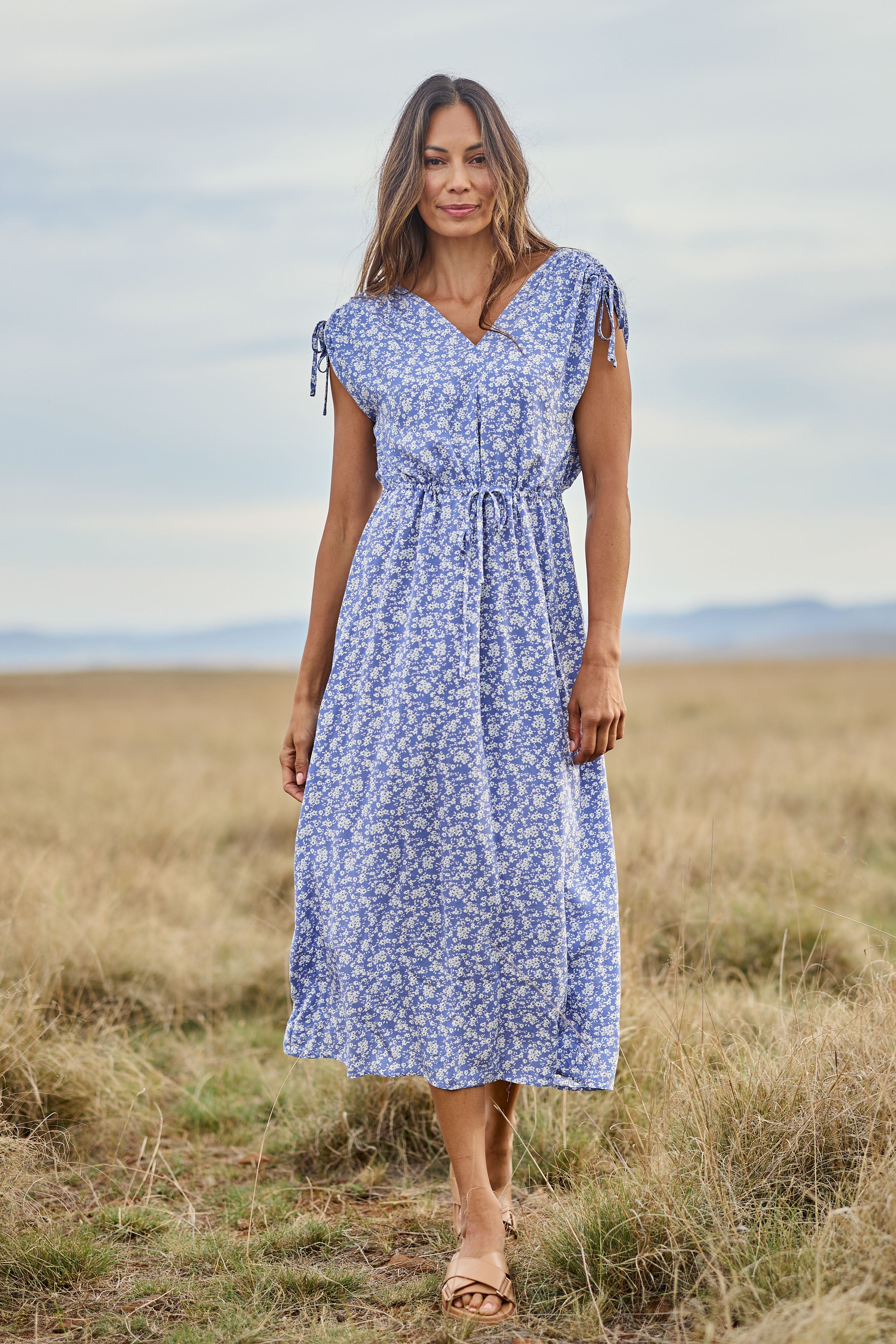 Model Amanda wearing size 10 of The Drawstring Printed Maxi Dress in colour Wedgewood (Blue), from the front, showing the whole outfit