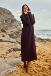 Model Amanda wearing size S of The Roll Neck Knit Maxi Dress in colour Burntplum (Purple), from the front, showing the whole outfit