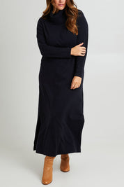 Model Laura wearing size L of The Roll Neck Knit Maxi Dress in colour Darknavy (Blue), from the front, cropped image