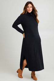 Model Laura wearing size L of The Roll Neck Knit Maxi Dress in colour Darknavy (Blue), from the front, showing the whole outfit