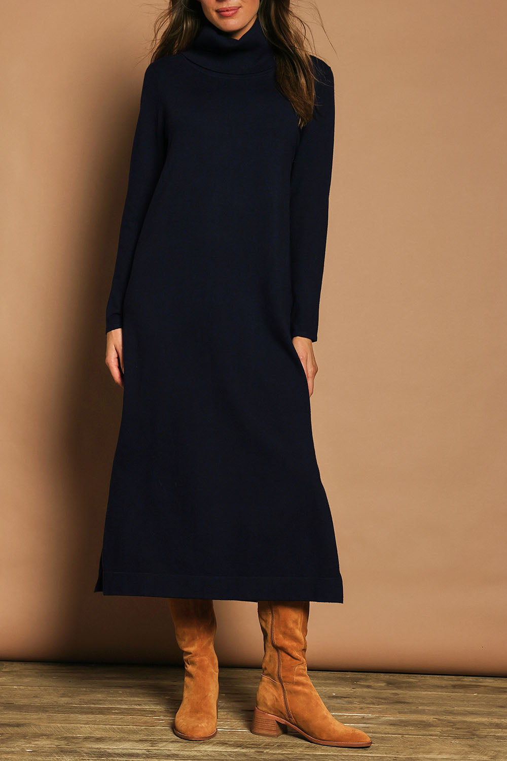 Model Madeline wearing size S of The Roll Neck Knit Maxi Dress in colour Darknavy (Blue), from the front, cropped image