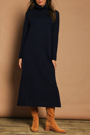 Model Madeline wearing size S of The Roll Neck Knit Maxi Dress in colour Darknavy (Blue), from the front, cropped image