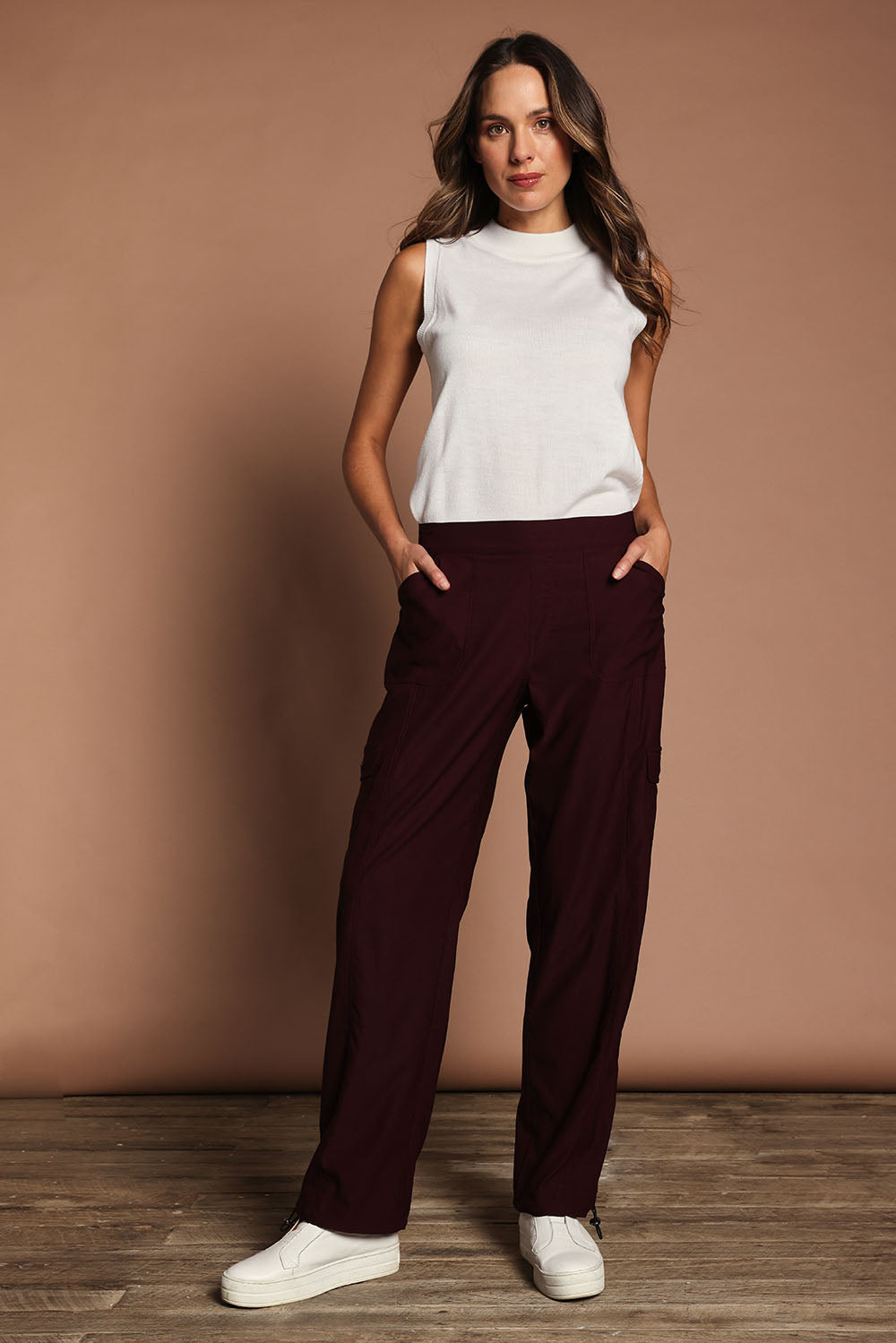 Model Madeline wearing size 10 of The Everyday Full Length Cargo Pant in colour Claret (Red), from the front, showing the whole outfit