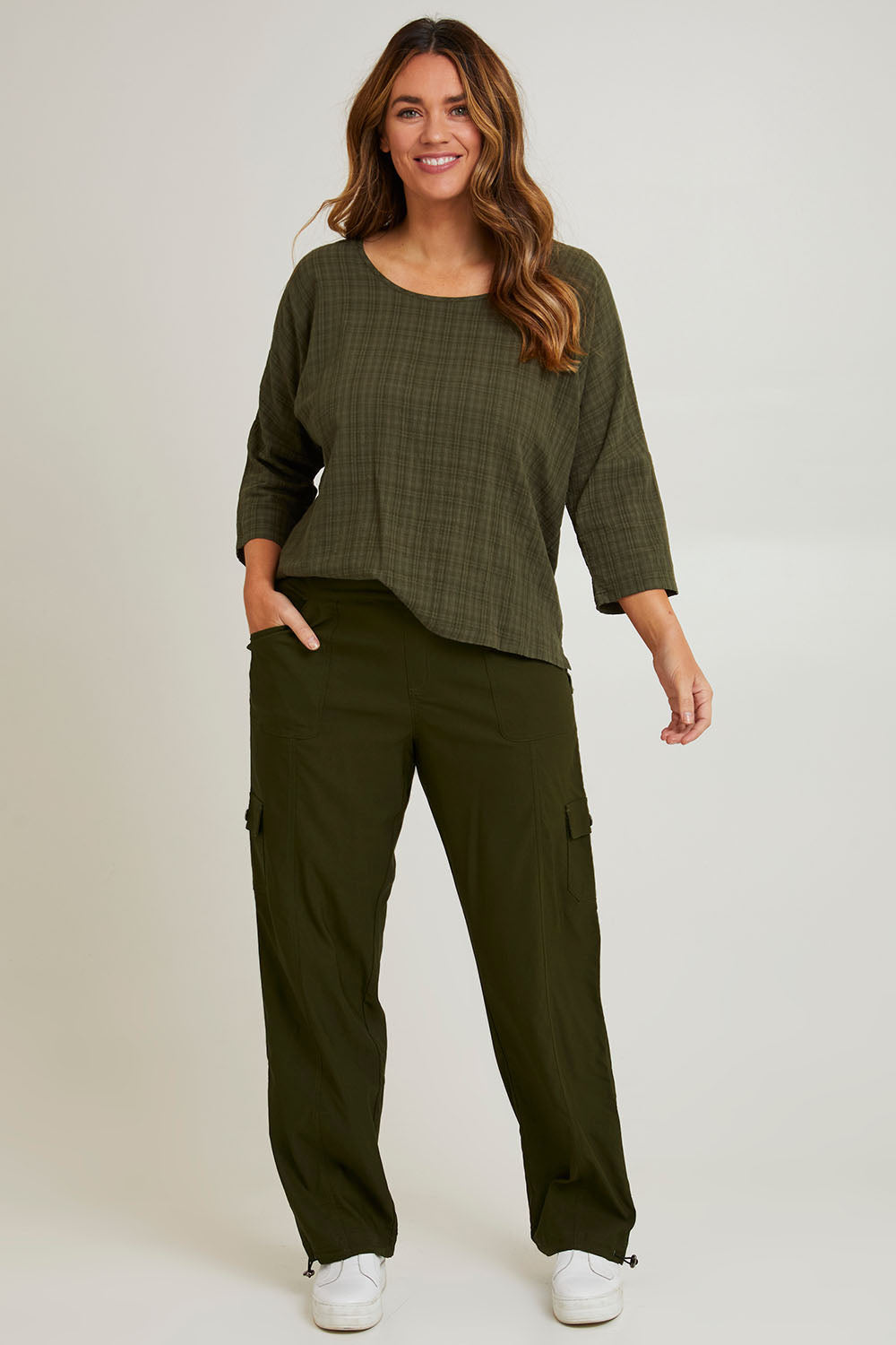 Model Laura wearing size 14 of The Everyday Full Length Cargo Pant in colour Olive (Green), from the front, showing the whole outfit