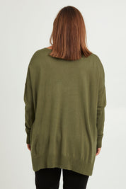 Model Monique wearing size L of The High Low V Neck Jumper in colour Khaki (Green), from the back