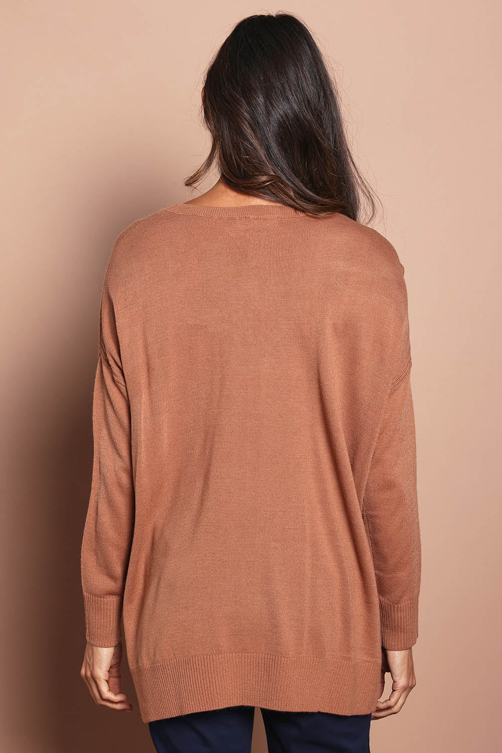 Model Amanda wearing size S of The High Low V Neck Jumper in colour Mushroom, from the back