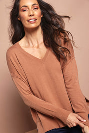 Model Amanda wearing size S of The High Low V Neck Jumper in colour Mushroom, from the front, cropped image