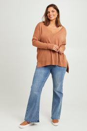 Model Monique wearing size L of The High Low V Neck Jumper in colour Mushroom, from the front, showing the whole outfit