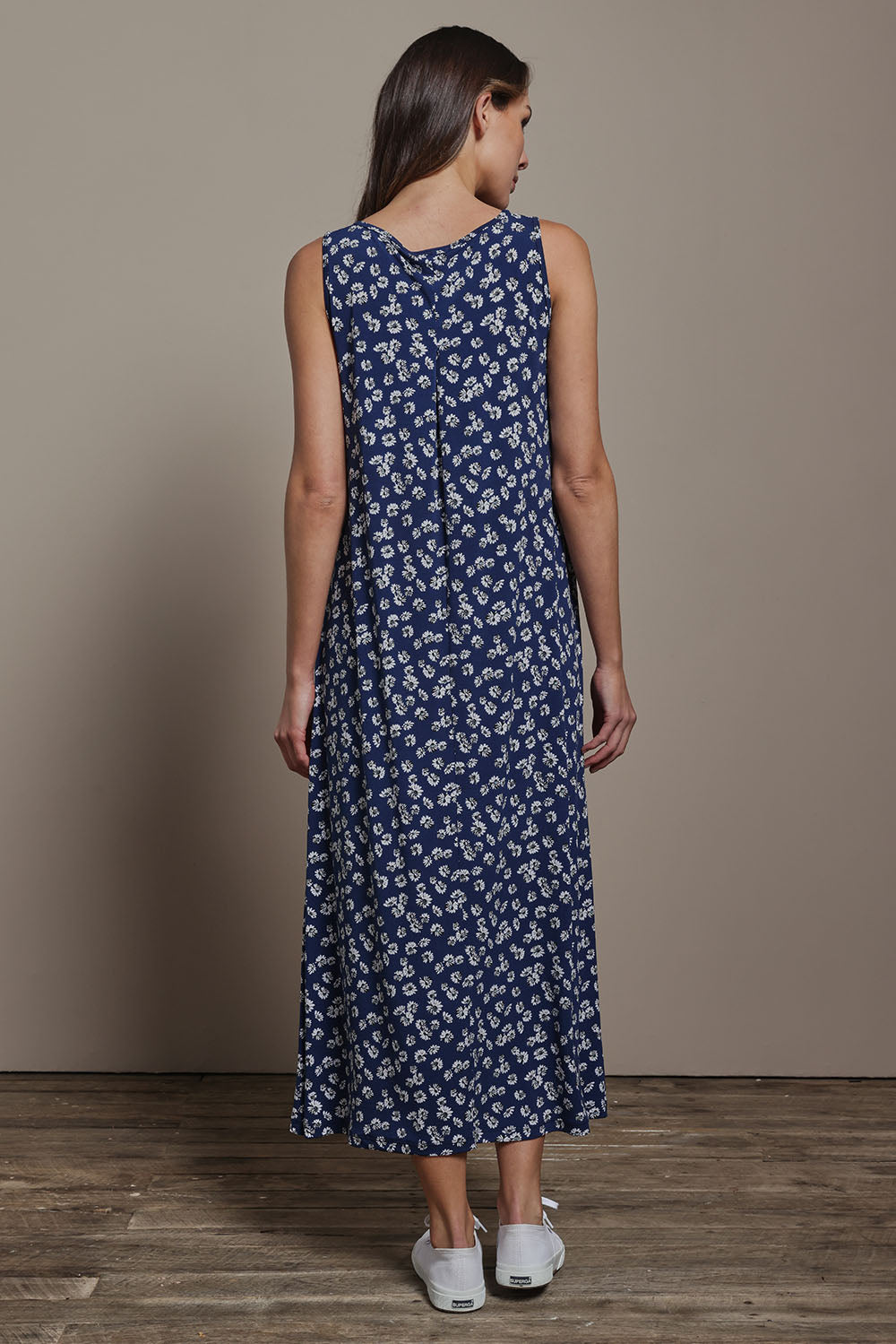 Model Madeline wearing size 10 of The Easy Wear Print Maxi Dress in colour Denimfleur (Blue), from the back