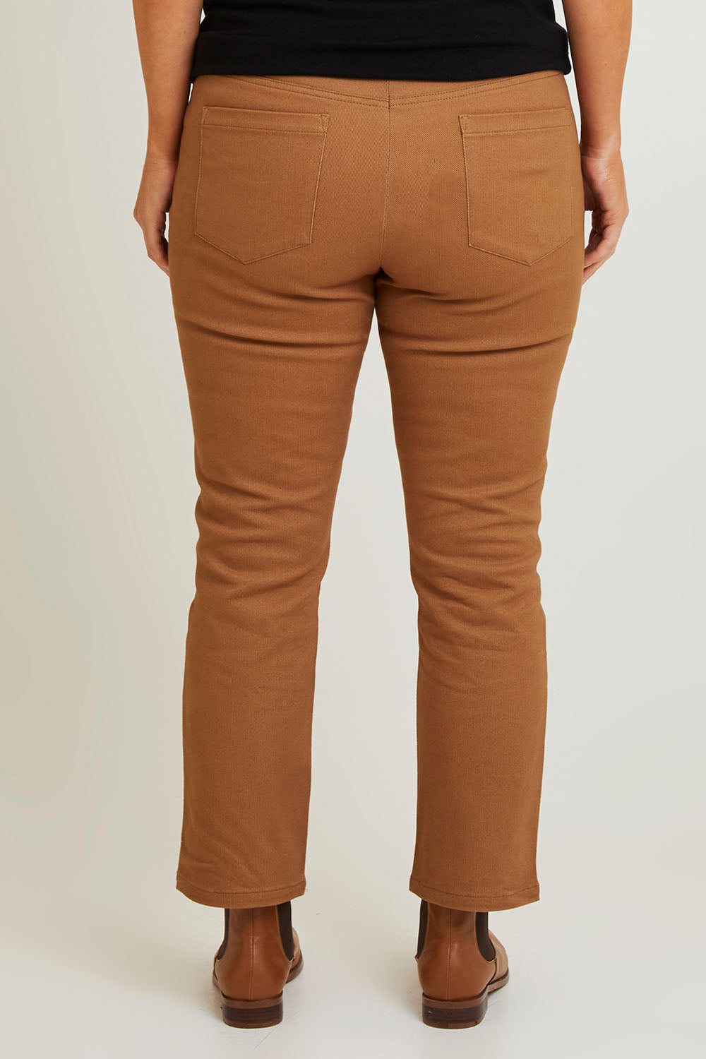 Model Laura wearing size 14 of The 7/8 Pull On Coloured Jean in colour Tobacco, from the back
