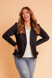 Model Laura wearing size 14 of The Everywear Cotton Blazer in colour Darknavy (Blue), from the front, showing the whole outfit