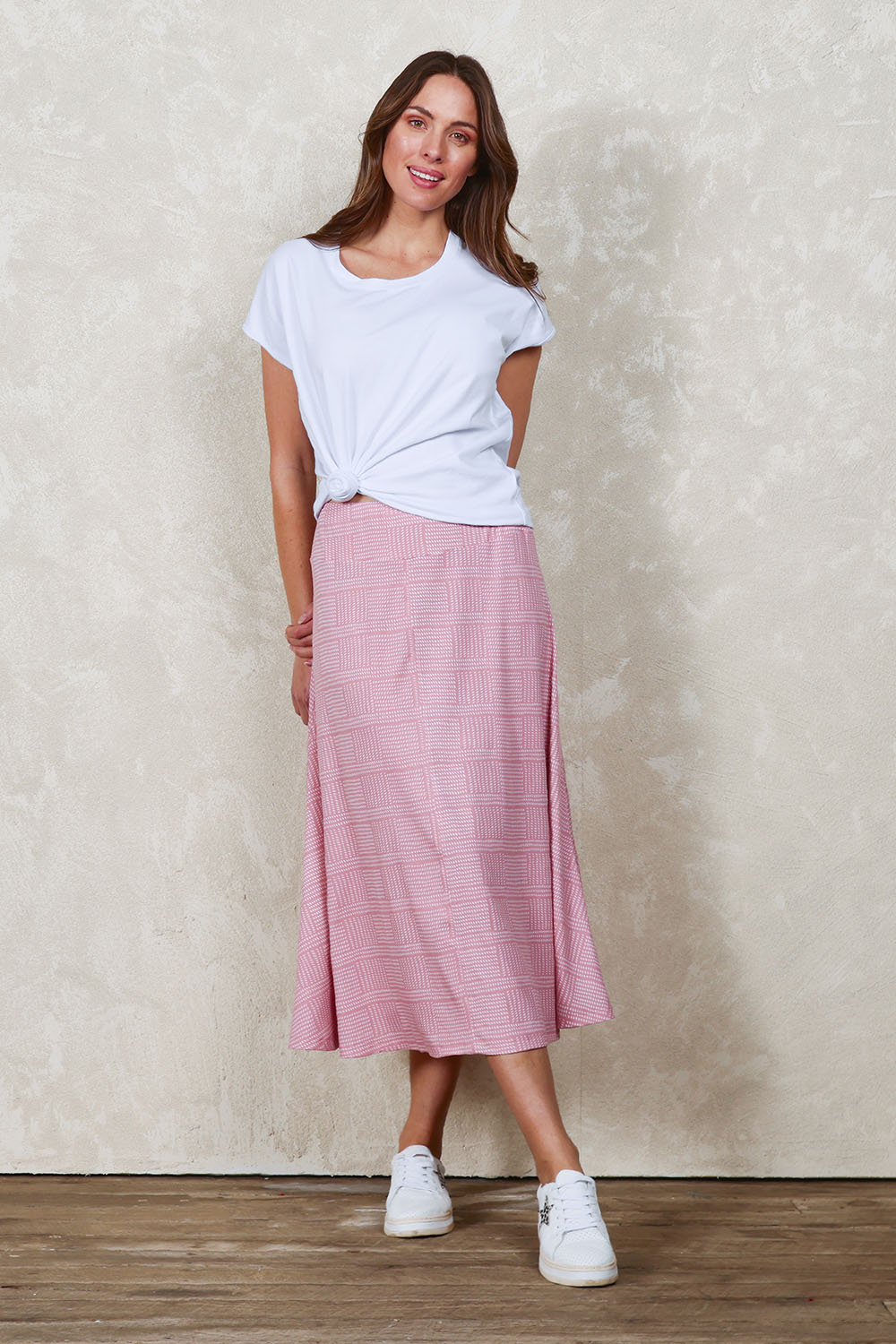 Model Madeline wearing size 10 of The Bamboo Blend Print Fit & Flare Skirt in colour Pinkblush (Pink), from the front, showing the whole outfit