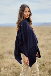 Model Amanda wearing The Every Season Poncho in colour Darknavy (Blue), from the front, showing the whole outfit