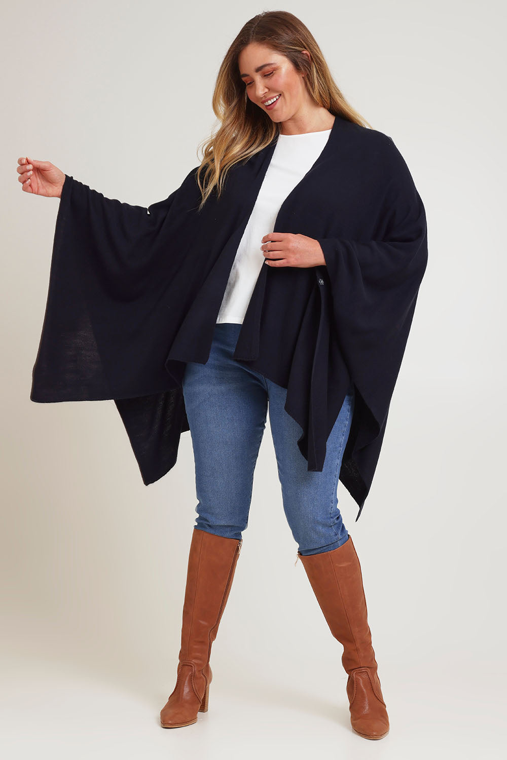 Model Chanel wearing The Every Season Poncho in colour Darknavy (Blue), from the front, showing the whole outfit