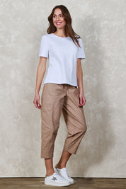 Model Madeline wearing size 10 of The Keepers Side Pocket Pant in colour Sand, from the front, showing the whole outfit