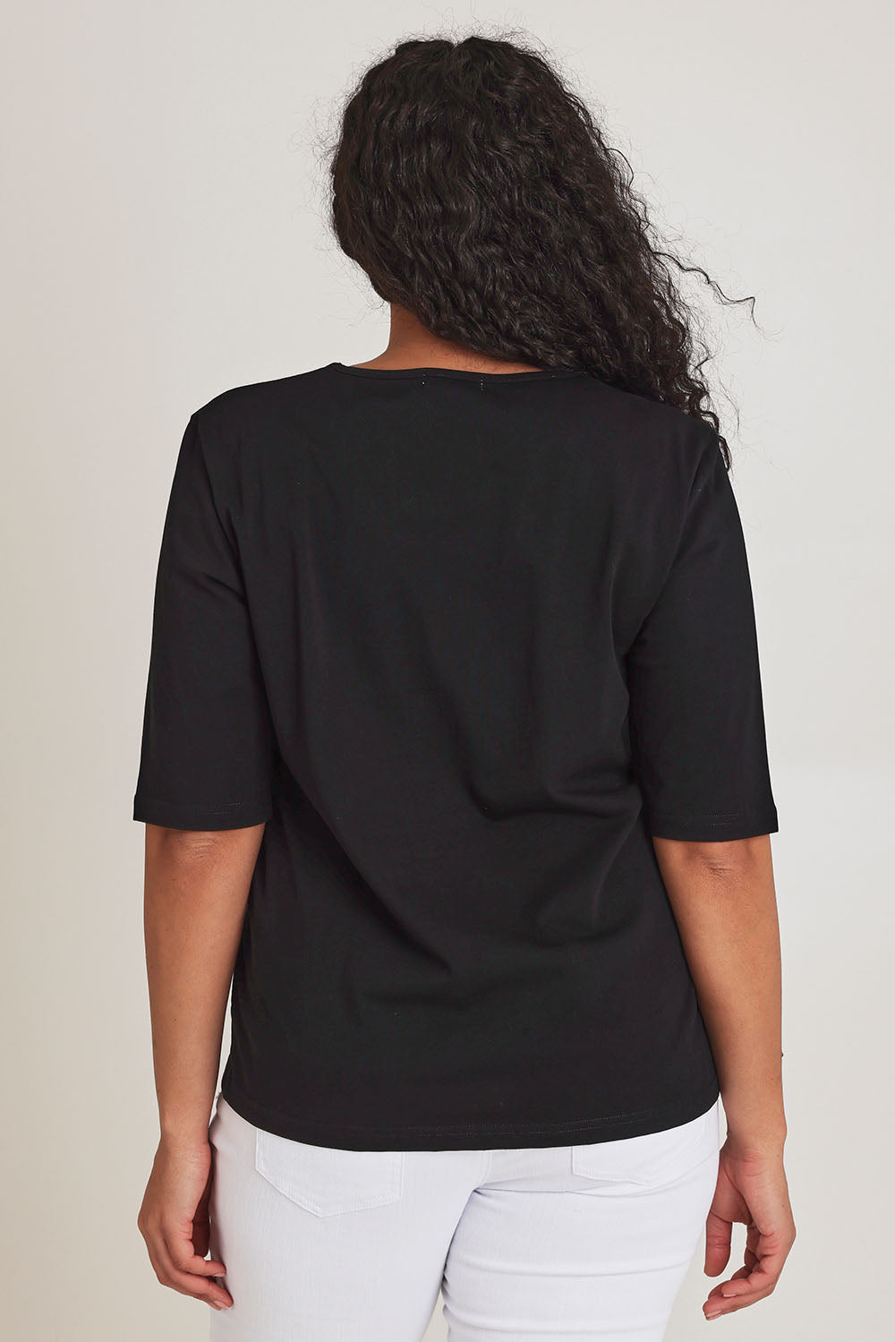Model Terri-Leigh wearing size 14 of The Luxe Pima Cotton Tee in colour Black (Black), from the back