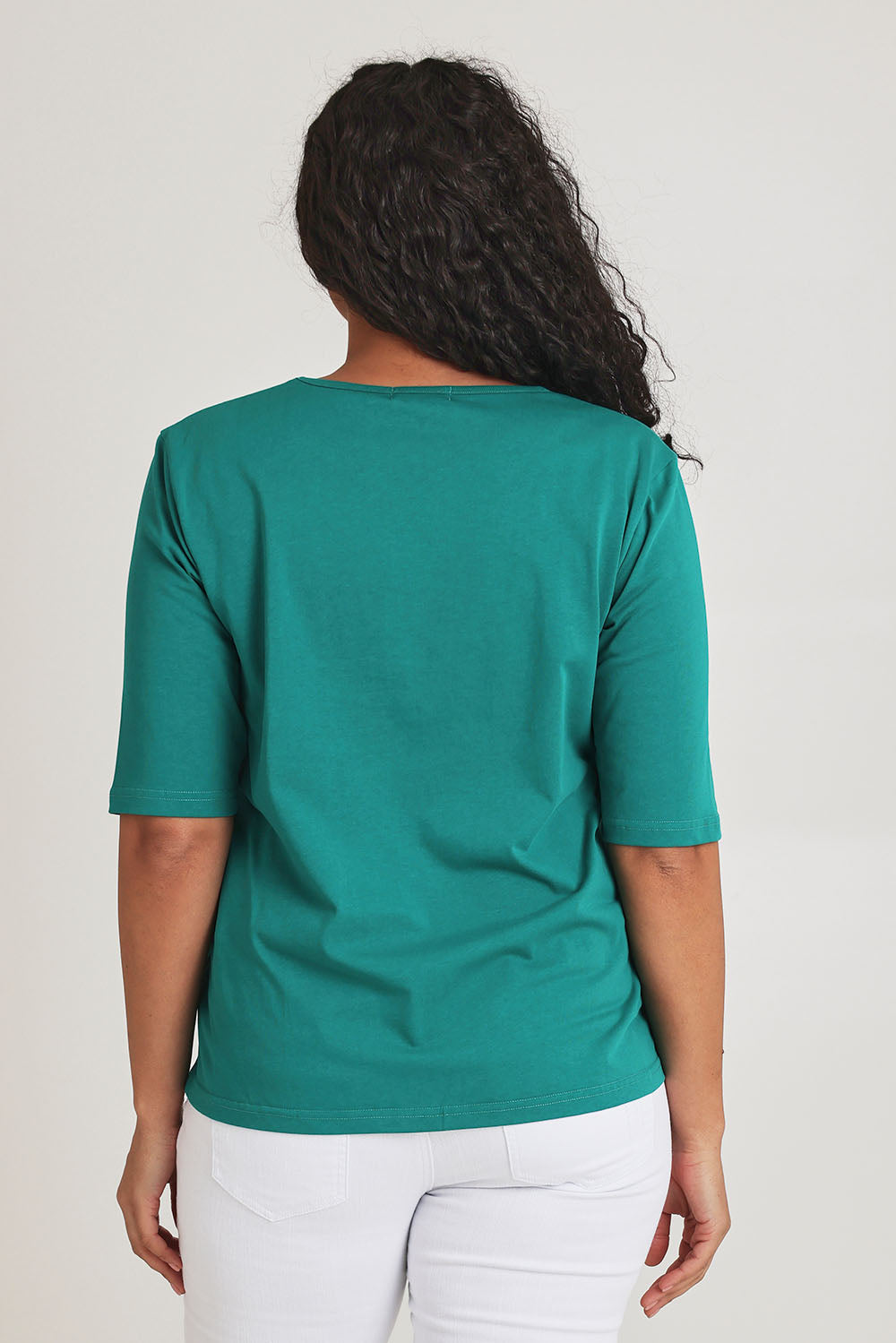 Model Terri-Leigh wearing size 14 of The Luxe Pima Cotton Tee in colour Grassgreen (Green), from the back