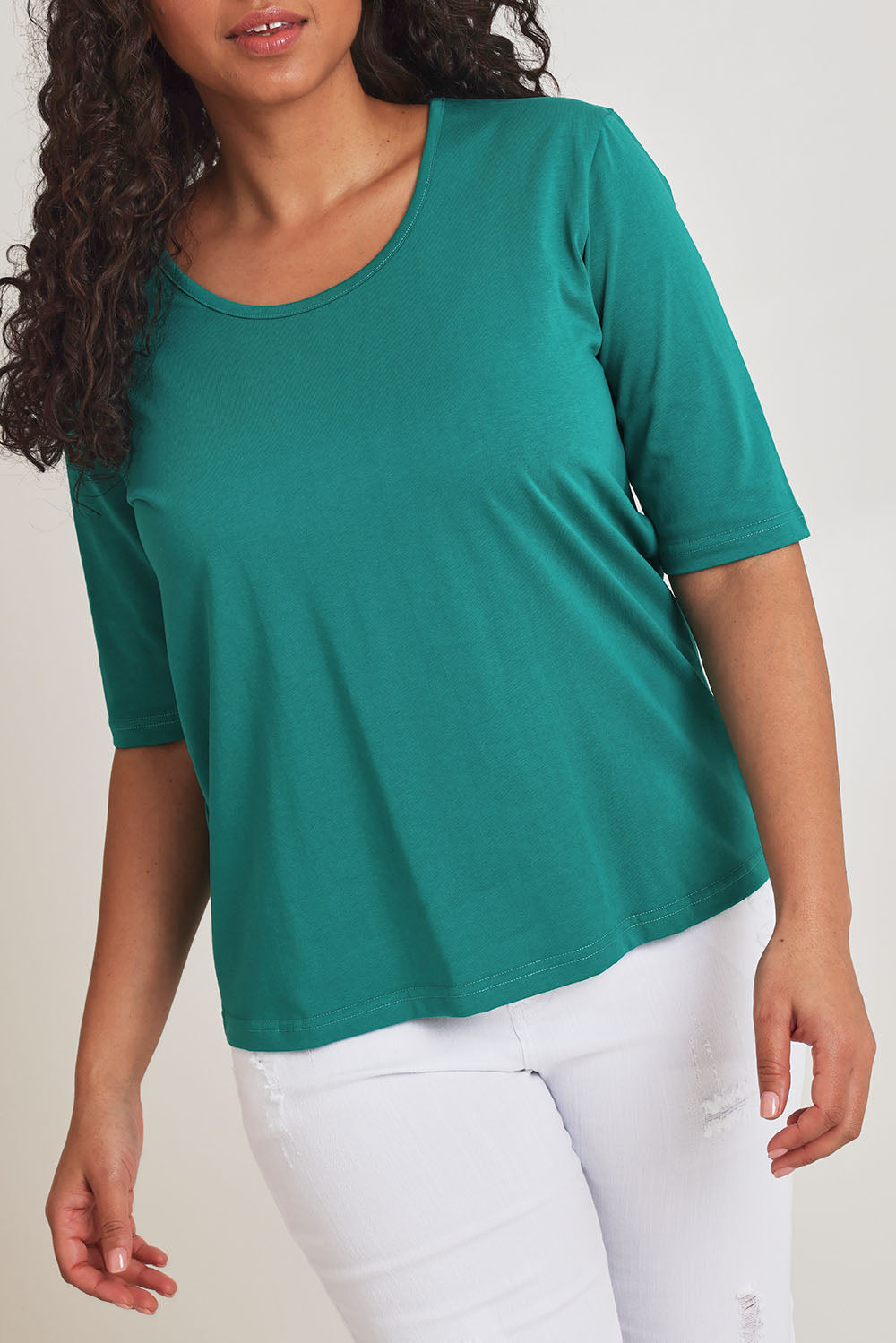 Model Terri-Leigh wearing size 14 of The Luxe Pima Cotton Tee in colour Grassgreen (Green), from the front, cropped image
