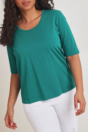 Model Terri-Leigh wearing size 14 of The Luxe Pima Cotton Tee in colour Grassgreen (Green), from the front, cropped image