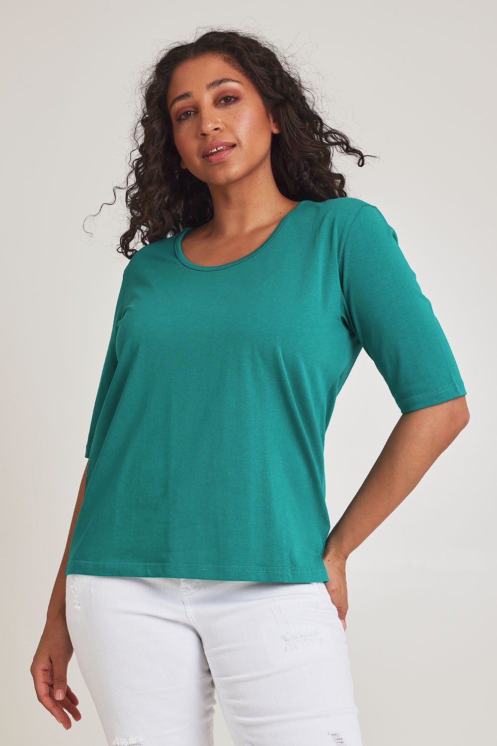 Model Terri-Leigh wearing size 14 of The Luxe Pima Cotton Tee in colour Grassgreen (Green), from the front, cropped image