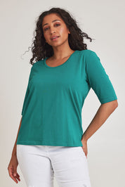 Model Terri-Leigh wearing size 14 of The Luxe Pima Cotton Tee in colour Grassgreen (Green), from the front, cropped image