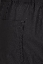 Product shot of the The Utility Shorts  - Black in colour Black, showing detail
