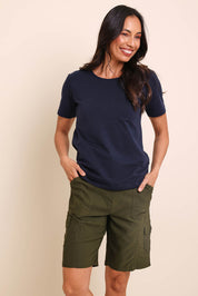 Model Amandam wearing size 10 of the The Utility Shorts  - Olive in colour Olive, in a cropped view