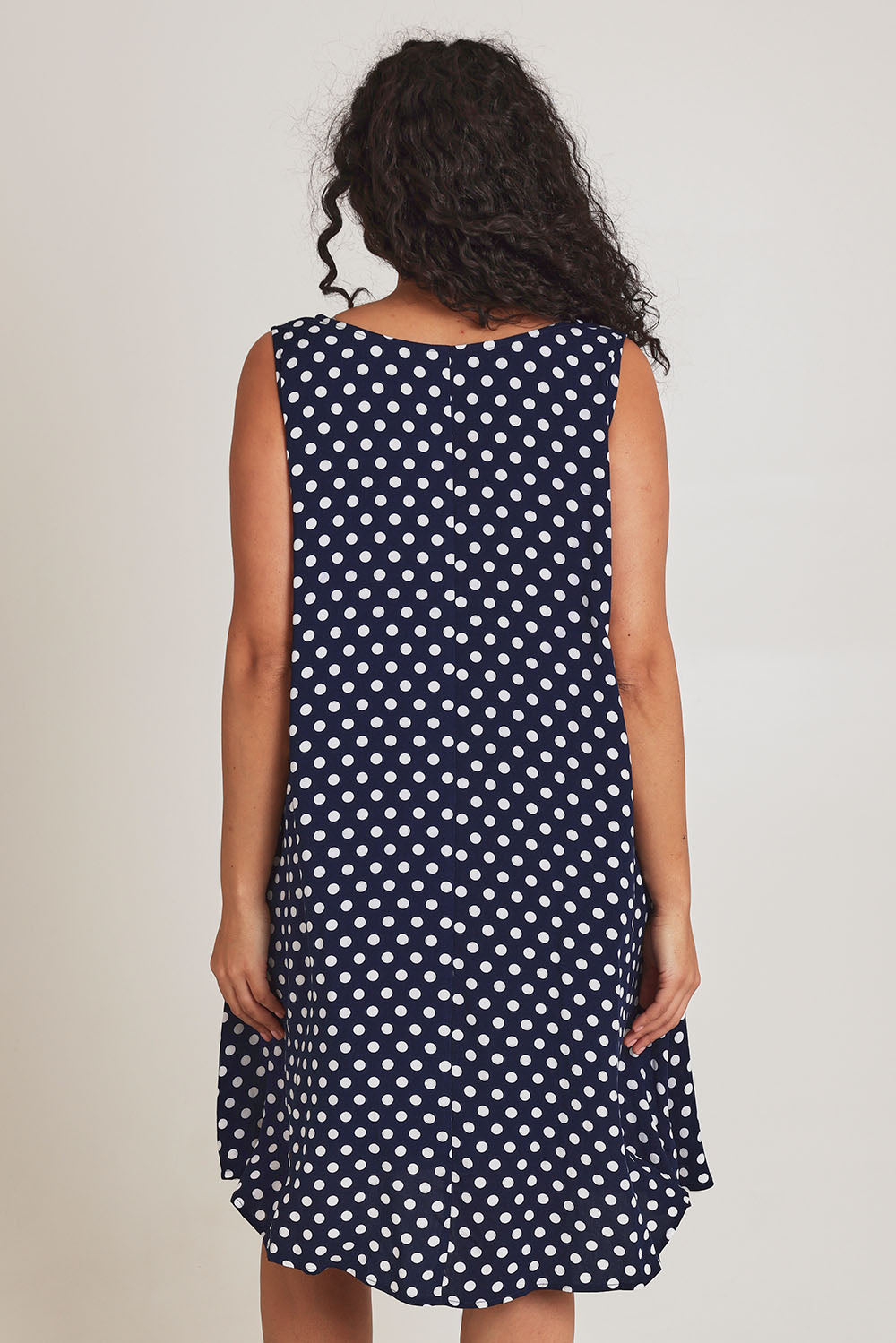 Model Terri-Leigh wearing size 14 of The Keepers Lined Swing Dress in colour Navywhite (Blue), from the back