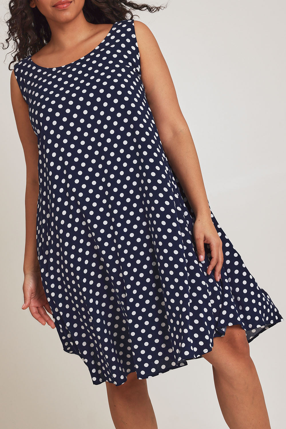 Model Terri-Leigh wearing size 14 of The Keepers Lined Swing Dress in colour Navywhite (Blue), from the front, cropped image