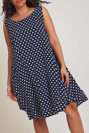 Model Terri-Leigh wearing size 14 of The Keepers Lined Swing Dress in colour Navywhite (Blue), from the front, cropped image