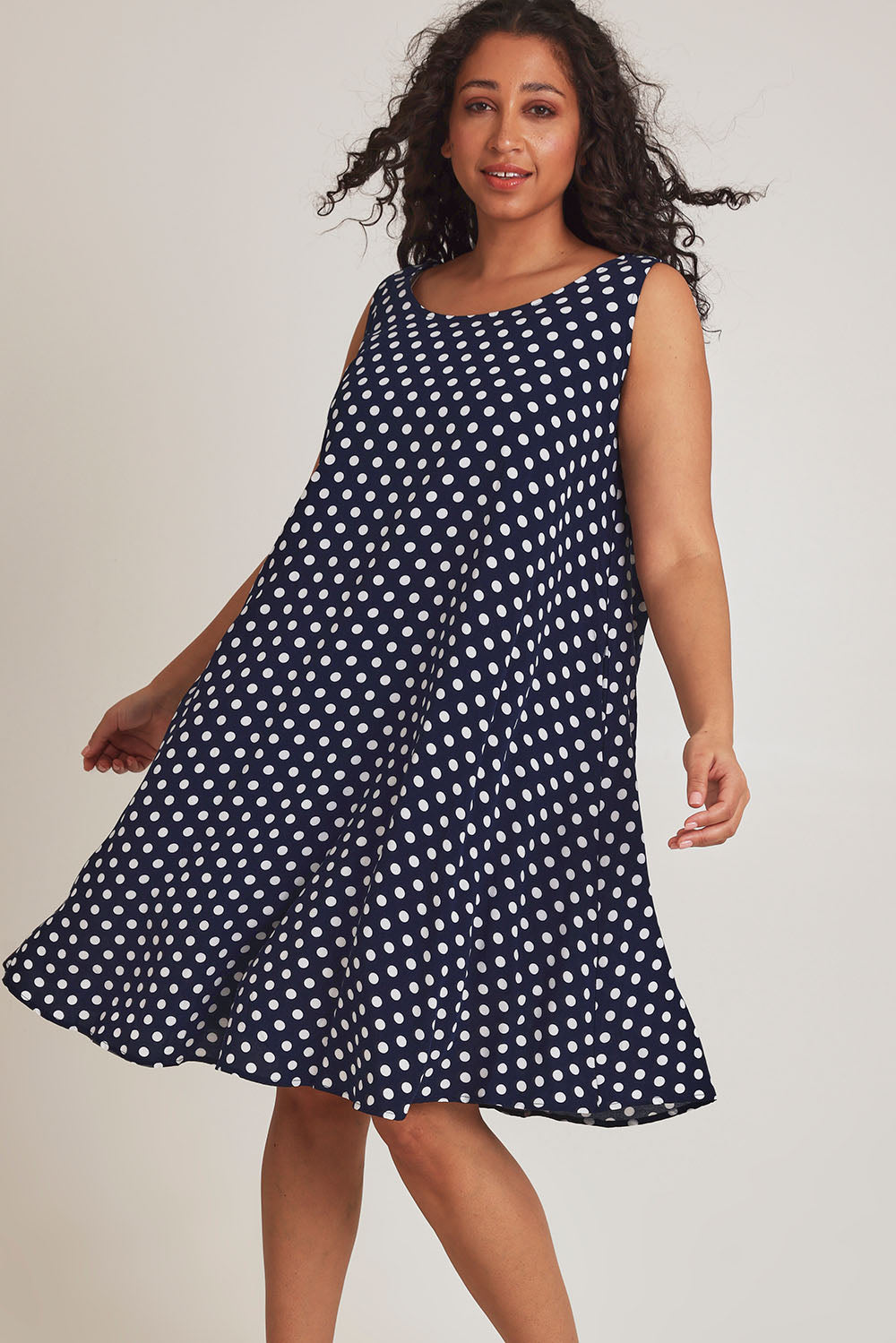 Model Terri-Leigh wearing size 14 of The Keepers Lined Swing Dress in colour Navywhite (Blue), from the front, cropped image