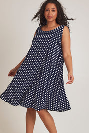 Model Terri-Leigh wearing size 14 of The Keepers Lined Swing Dress in colour Navywhite (Blue), from the front, cropped image